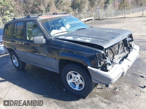 1996 Jeep Grand Cherokee Laredo with VIN 1J4GZ58S9TC268615, listed as a IAAI auction lot 41527984 with 248,443 mi miles. Bid and sale history available at carsss.com. Image 1.