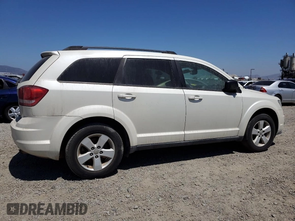 2013 Dodge Journey American Value with VIN 3C4PDCAB2DT547459, listed as a Copart auction lot 61217605 with 116,740 mi miles and Clean title. Bid and sale history available at DreamBid. Image 3.