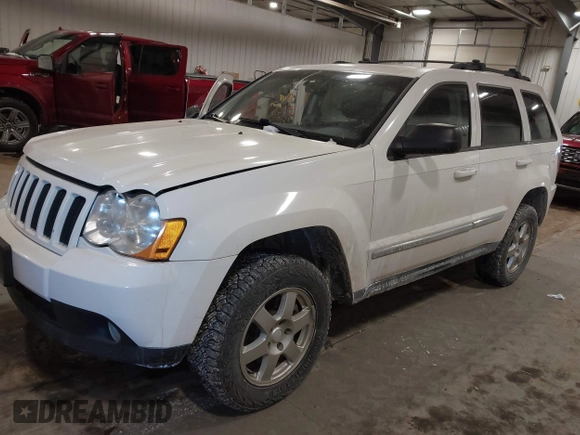 2010 Jeep Grand Cherokee Laredo with VIN 1J4PR4GK7AC126059, listed as a IAAI auction lot 41599058 with 154,192 mi miles. Bid and sale history available at carsss.com. Image 2.