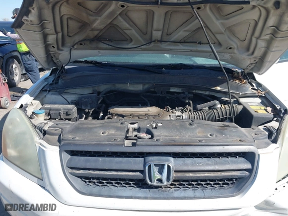 2005 Honda Pilot EX-L with NAVI with VIN 2HKYF18775H571312, listed as a IAAI auction lot 41830609 with 297,923 mi miles. Bid and sale history available at carsss.com. Image 10.