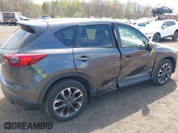 2016 Mazda CX-5 Grand Touring z VIN JM3KE4DY1G0893119, wystawiony jako IAAI lot #42049614 z przebiegiem 102 506 mil mil oraz . Historia ofert i sprzedaży dostępna na DreamBid. Obrazek 17.