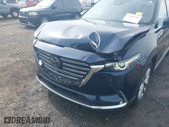 2020 Mazda CX-9 Grand Touring with VIN JM3TCBDY1L0402718, listed as a IAAI auction lot 42355511 with 87,205 mi miles and . Bid and sale history available at DreamBid. Image 6.