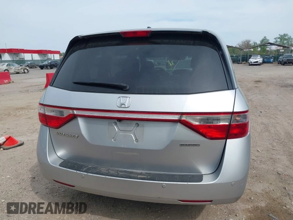 2012 Honda Odyssey Touring with VIN 5FNRL5H92CB055473, listed as a IAAI auction lot 42128601 with 163,901 mi miles. Bid and sale history available at carsss.com. Image 16.