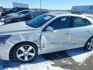 2014 Chevrolet Malibu LTZ with VIN 1G11J5SX5EF215539, listed as a IAAI auction lot 41636911 with 110,484 mi miles. Bid and sale history available at carsss.com. Image 6.
