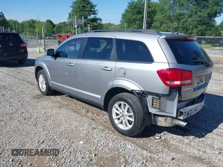 2017 Dodge Journey SXT z VIN 3C4PDCBG4HT563310, wystawiony jako IAAI lot #42190636 z przebiegiem 171 054 mil mil oraz . Historia ofert i sprzedaży dostępna na DreamBid. Obrazek 3.