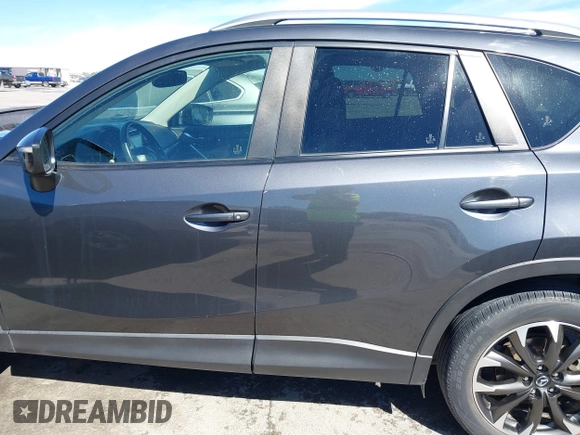 2016 Mazda CX-5 Grand Touring with VIN JM3KE2DY9G0824196, listed as a IAAI auction lot 41801887 with 88,625 mi miles. Bid and sale history available at carsss.com. Image 15.