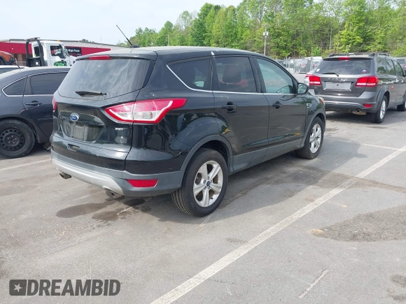 2016 Ford Escape SE with VIN 1FMCU0G73GUA91025, listed as a IAAI auction lot 42100978 with 164,241 mi miles. Bid and sale history available at carsss.com. Image 4.