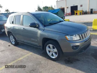 2011 Jeep Compass with VIN 1J4NT1FA4BD213994, listed as a IAAI auction lot 42020375 with 84,409 mi miles. Bid and sale history available at carsss.com. Image 1.