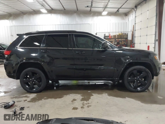 2015 Jeep Grand Cherokee Laredo with VIN 1C4RJFAG3FC115444, listed as a IAAI auction lot 41248211 with 138,828 mi miles. Bid and sale history available at carsss.com. Image 14.