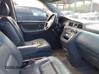 2004 Honda Odyssey EX-L with VIN 5FNRL18924B064040, listed as a IAAI auction lot 41350306 with 130,803 mi miles and . Bid and sale history available at DreamBid. Image 5.