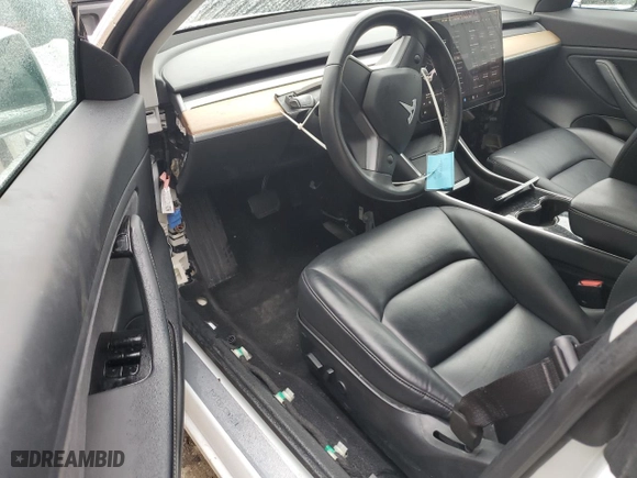 2019 Tesla Model 3 Mid Range with VIN 5YJ3E1EA7KF317543, listed as a Copart auction lot 83594454 with 58,550 mi miles and Non Repairable. Bid and sale history available at carsss.com. Image 8.