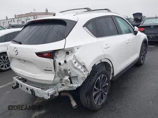 2022 Mazda CX-5 S Premium Plus with VIN JM3KFBEM6N0615083, listed as a IAAI auction lot 41907406 with 49,617 mi miles and . Bid and sale history available at carsss.com. Image 4.