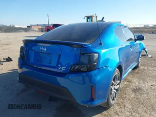 2014 Scion tC with VIN JTKJF5C78E3079618, listed as a IAAI auction lot 41107330 with 112,105 mi miles. Bid and sale history available at carsss.com. Image 4.