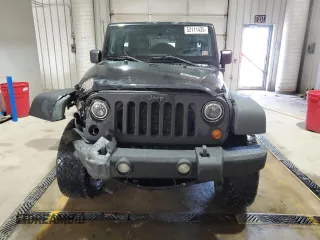 2009 Jeep Wrangler Unlimited Rubicon with VIN 1J8GA69179L756441, listed as a Copart auction lot 52111435 with 157,818 mi miles and Salvage title. Bid and sale history available at DreamBid. Image 5.