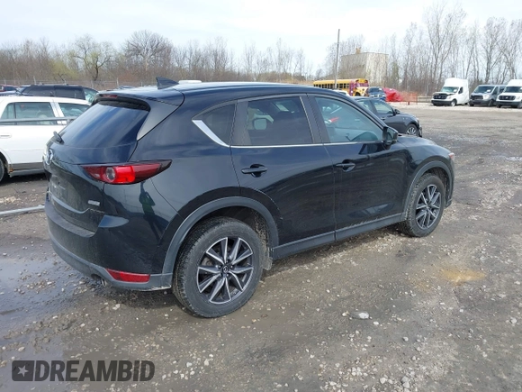 2018 Mazda CX-5 Touring with VIN JM3KFBCMXJ0438177, listed as a IAAI auction lot 42152275 with 65,434 mi miles and . Bid and sale history available at carsss.com. Image 4.