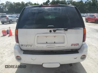 2005 GMC Envoy SLT with VIN 1GKDT13S052311455, listed as a Copart auction lot 73635434 with Not Provided miles and Salvage Title. Bid and sale history available at DreamBid. Image 6.