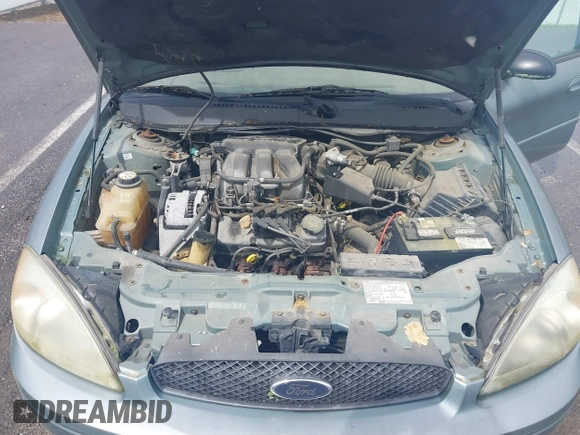 2005 Ford Taurus SE with VIN 1FAFP53U55A209369, listed as a IAAI auction lot 42144800 with 152,446 mi miles. Bid and sale history available at carsss.com. Image 10.