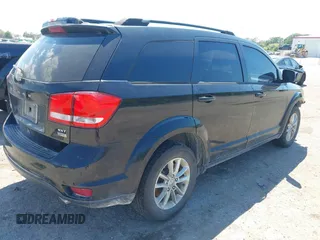 2014 Dodge Journey SXT with VIN 3C4PDCBG5ET250732, listed as a IAAI auction lot 41900940 with 144,301 mi miles. Bid and sale history available at carsss.com. Image 4.