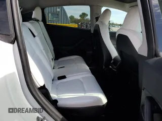 2023 Tesla Model Y Long Range with VIN 7SAYGAEE6PF795434, listed as a Copart auction lot 67507984 with 24,469 mi miles and Salvage Title. Bid and sale history available at DreamBid. Image 10.