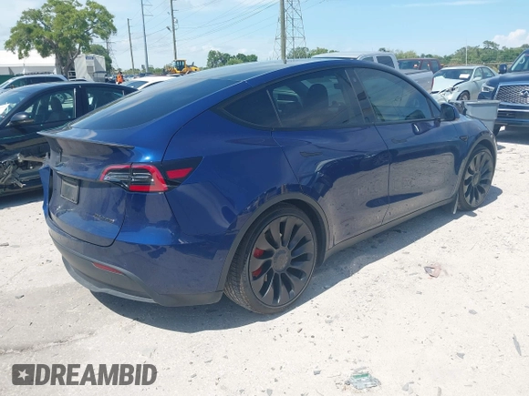 2023 Tesla Model Y Performance with VIN 7SAYGDEF9PF582908, listed as a IAAI auction lot 41930957 with 52,857 mi miles and . Bid and sale history available at DreamBid. Image 4.