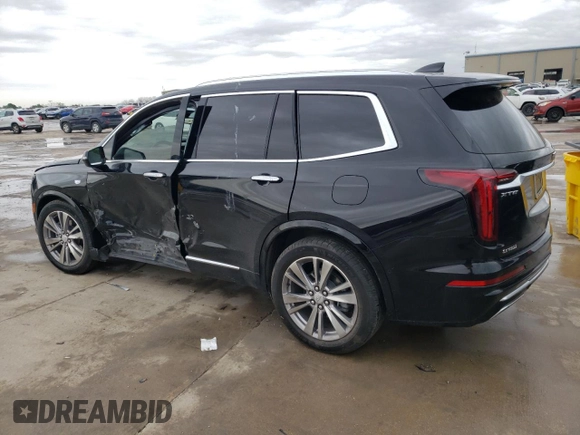 2023 Cadillac XT6 FWD Premium Luxury z VIN 1GYKPCRS5PZ101867, wystawiony jako Copart lot #51773545 z przebiegiem 31 322 mil mil oraz Szkoda całkowita • Salvage title. Historia ofert i sprzedaży dostępna na DreamBid. Obrazek 2.