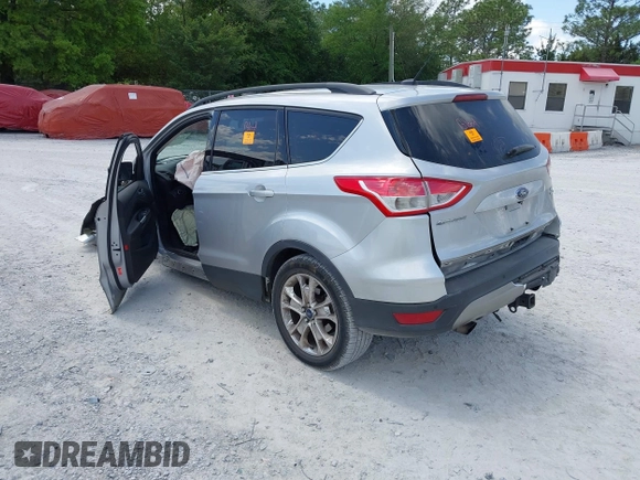 2016 Ford Escape SE with VIN 1FMCU9G92GUC28879, listed as a IAAI auction lot 42021065 with 99,184 mi miles. Bid and sale history available at carsss.com. Image 3.