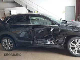 2023 Mazda CX-30 S Premium z VIN 3MVDMBDM5PM589289, wystawiony jako IAAI lot #41331253 z przebiegiem 24 804 mil mil oraz . Historia ofert i sprzedaży dostępna na DreamBid. Obrazek 13.