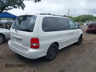 2004 Kia Sedona LX with VIN KNDUP131446493787, listed as a IAAI auction lot 40004348 with 168,374 mi miles. Bid and sale history available at carsss.com. Image 4.
