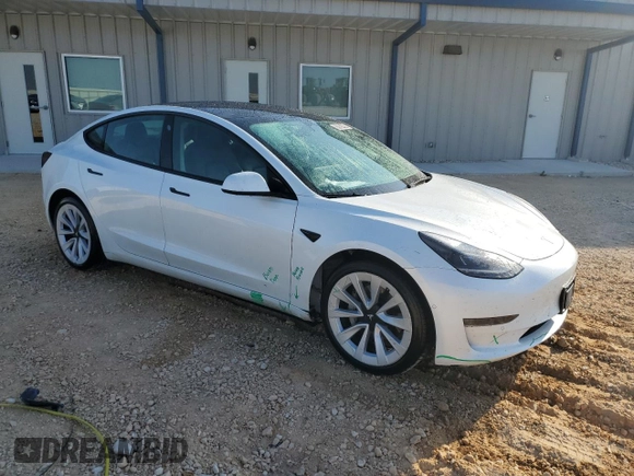 2022 Tesla Model 3 with VIN 5YJ3E1EA7NF184741, listed as a Copart auction lot 82487494 with 133,215 mi miles and Clean Title. Bid and sale history available at DreamBid. Image 4.