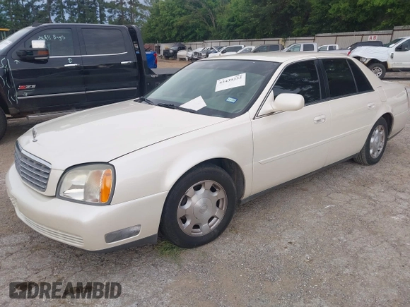 2002 Cadillac DeVille z VIN 1G6KD54Y92U130111, wystawiony jako IAAI lot #42439252 z przebiegiem 194 669 mil mil oraz . Historia ofert i sprzedaży dostępna na DreamBid. Obrazek 2.