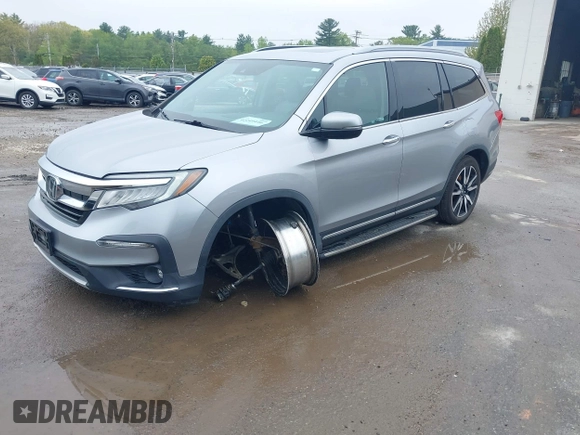 2020 Honda Pilot Touring 8-Passenger z VIN 5FNYF6H91LB042626, wystawiony jako IAAI lot #42249440 z przebiegiem 57 429 mil mil oraz . Historia ofert i sprzedaży dostępna na DreamBid. Obrazek 17.