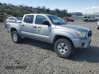 2015 Toyota Tacoma with VIN 3TMLU4EN2FM179631, listed as a Copart auction lot 57769855 with 106,288 mi miles and Salvage title. Bid and sale history available at DreamBid. Image 4.