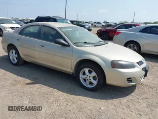 2006 Dodge Stratus SXT z VIN 1B3EL46X36N144440, wystawiony jako IAAI lot #41869741 z przebiegiem 122 618 mil mil oraz . Historia ofert i sprzedaży dostępna na DreamBid. Obrazek 1.