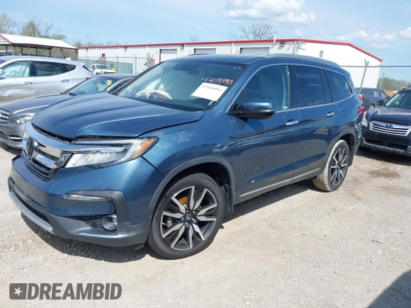 2020 Honda Pilot Touring 8-Passenger with VIN 5FNYF6H93LB034009, listed as a IAAI auction lot 42090993 with 73,325 mi miles and . Bid and sale history available at carsss.com. Image 2.