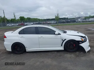 2013 Mitsubishi Lancer Evolution GSR z VIN JA32W8FV0DU023509, wystawiony jako IAAI lot #42222552 z przebiegiem 128 030 mil mil oraz . Historia ofert i sprzedaży dostępna na DreamBid. Obrazek 13.