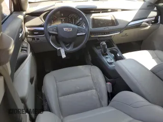 2023 Cadillac XT4 FWD Luxury z VIN 1GYAZAR46PF178003, wystawiony jako Copart lot #52024665 z przebiegiem 42 000 mil mil oraz Szkoda całkowita • Salvage title. Historia ofert i sprzedaży dostępna na DreamBid. Obrazek 8.
