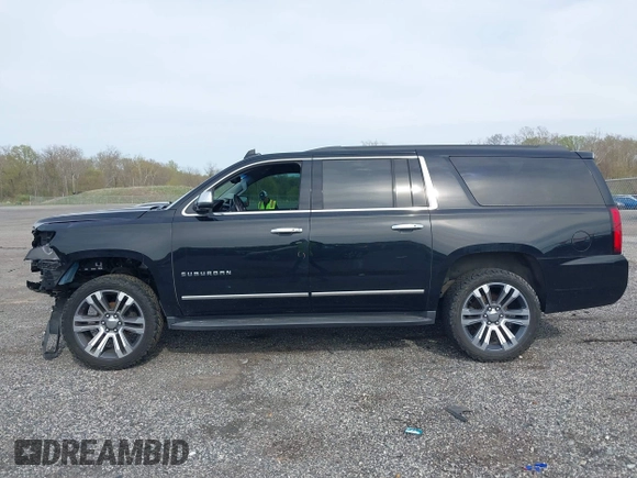 2019 Chevrolet Suburban LT with VIN 1GNSCHKC2KR408575, listed as a IAAI auction lot 42060103 with 144,838 mi miles and . Bid and sale history available at DreamBid. Image 14.