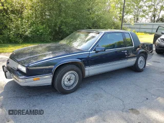 1988 Cadillac Eldorado z VIN 1G6EL1155JU600524, wystawiony jako Copart lot #59505125 z przebiegiem 110 972 mil mil oraz Szkoda całkowita • Salvage title. Historia ofert i sprzedaży dostępna na DreamBid. Obrazek 1.