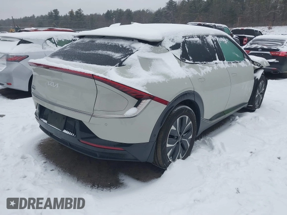 2022 Kia EV6 Wind z VIN KNDC3DLCXN5061934, wystawiony jako IAAI lot #41452465 z przebiegiem 74 923 mil mil oraz . Historia ofert i sprzedaży dostępna na DreamBid. Obrazek 4.