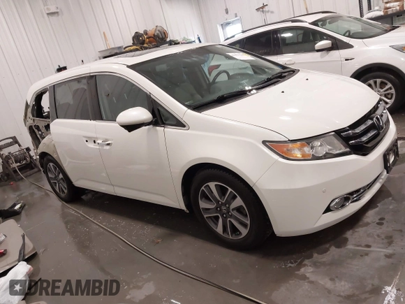 2015 Honda Odyssey Touring Elite with VIN 5FNRL5H92FB020159, listed as a IAAI auction lot 42103240 with 79,322 mi miles and . Bid and sale history available at DreamBid. Image 1.