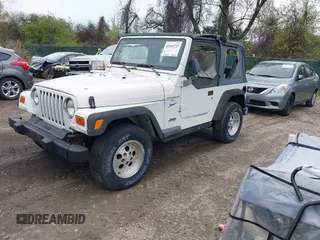 1998 Jeep Wrangler Sport with VIN 1J4FY19S0WP779147, listed as a IAAI auction lot 42045723 with 205,822 mi miles. Bid and sale history available at carsss.com. Image 2.