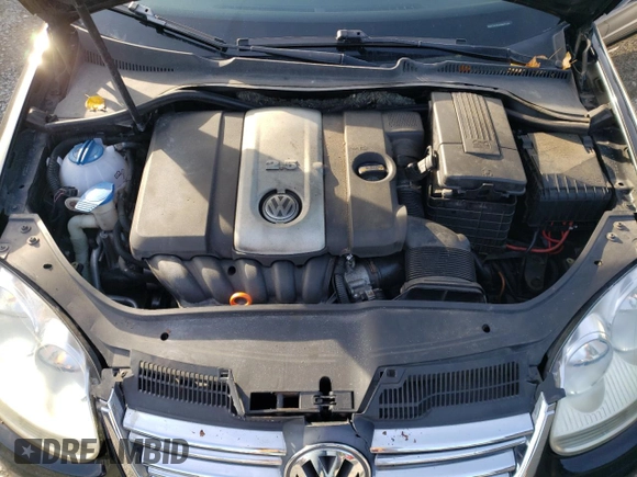 2009 Volkswagen Jetta z VIN 3VWTZ71K99M252459, wystawiony jako Copart lot #77893704 z przebiegiem 181 022 mil mil oraz Szkoda całkowita • Salvage title. Historia ofert i sprzedaży dostępna na DreamBid. Obrazek 12.