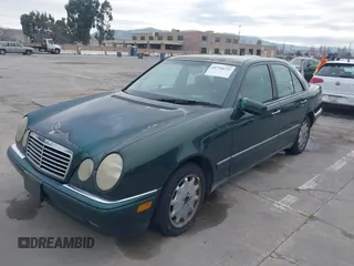 1997 Mercedes-Benz E-Class with VIN WDBJF55F3VJ034009, listed as a IAAI auction lot 41710225 with 239,673 mi miles. Bid and sale history available at carsss.com. Image 6.