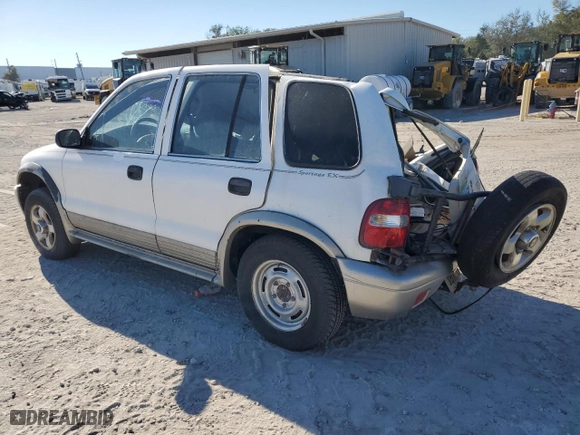 1998 Kia Sportage with VIN KNDJB7232W5569054, listed as a Copart auction lot 82756824 with 106,550 mi miles and Salvage Title. Bid and sale history available at carsss.com. Image 2.