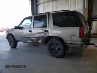 1999 Chevrolet Tahoe Z71 z VIN 1GNEK13R2XJ338897, wystawiony jako Copart lot #54219225 z przebiegiem 232 020 mil mil oraz Szkody całkowita. Historia ofert i sprzedaży dostępna na DreamBid. Obrazek 2.
