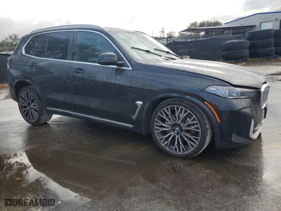 2024 BMW X5 xDrive40i with VIN 5UX23EU00R9U62752, listed as a Copart auction lot 85104184 with 23,547 mi miles and Salvage Title. Bid and sale history available at carsss.com. Image 4.