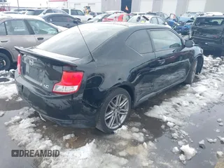 2013 Scion tC with VIN JTKJF5C72D3055801, listed as a IAAI auction lot 41102753 with 242,146 mi miles. Bid and sale history available at carsss.com. Image 4.