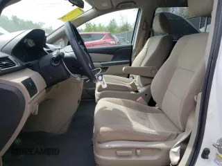 2014 Honda Odyssey LX with VIN 5FNRL5H27EB116435, listed as a Copart auction lot 52864825 with 94,643 mi miles and Salvage Title. Bid and sale history available at DreamBid. Image 7.