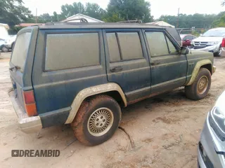 1993 Jeep Cherokee Country with VIN 1J4FJ78S0PL519025, listed as a IAAI auction lot 42409707 with 162,231 mi miles and . Bid and sale history available at DreamBid. Image 4.