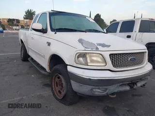 1999 Ford F-150 XL with VIN 1FTRX18L1XKB61205, listed as a IAAI auction lot 40991236 with 178,889 mi miles. Bid and sale history available at carsss.com. Image 1.